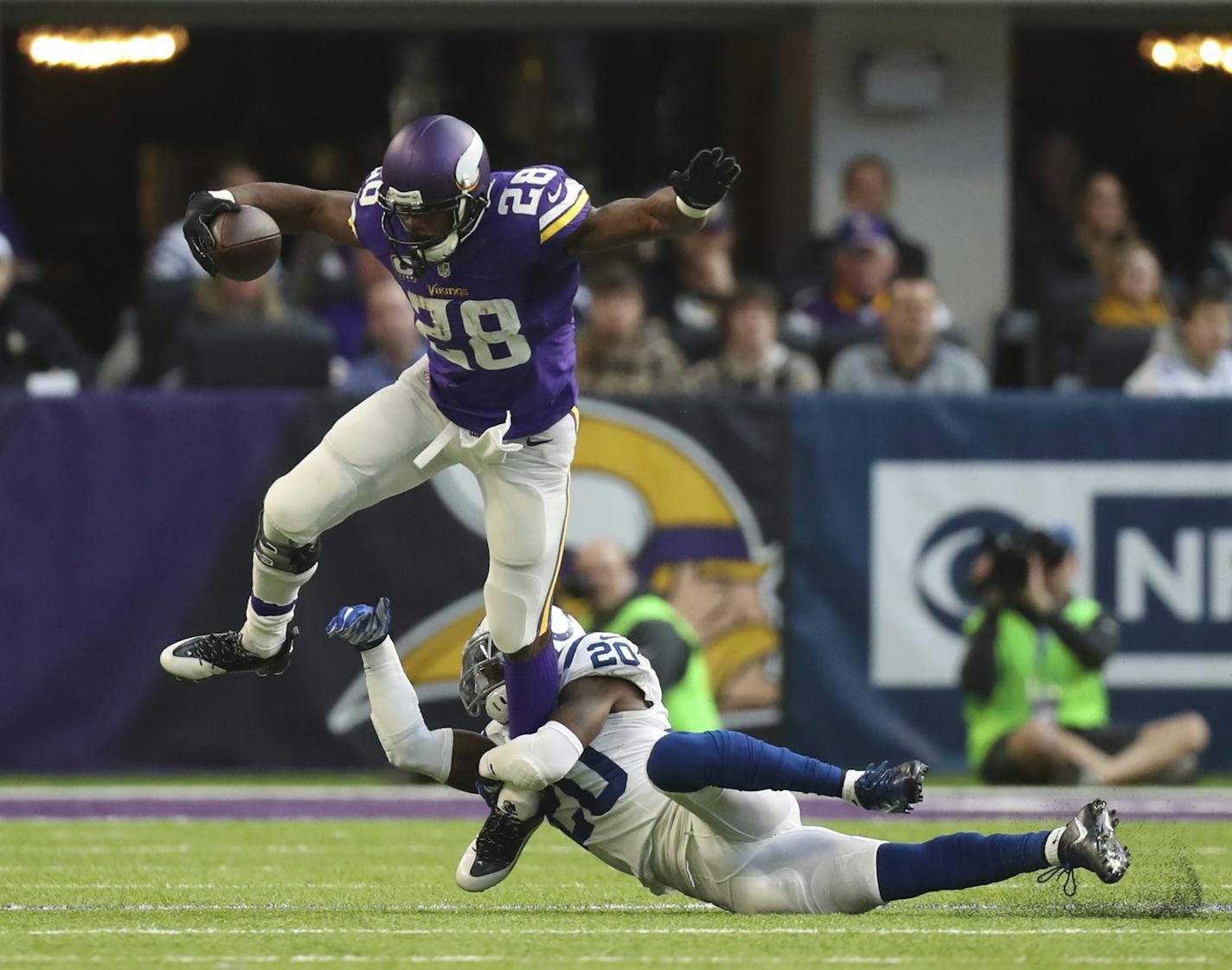 Vikings running back Adrian Peterson (28) tried to step out of a tackle by Indianapolis Colts free safety Darius Butler (20) afer catching a pass for a one yard gain on his second touch of the game. ] JEFF WHEELER &#xef; jeff.wheeler@startribune.com The Vikings lost 34-6 to the Indianapolis Colts in an NFL football game Sunday afternoon, December 18, 2016 at U.S. Bank Stadium in Minneapolis.