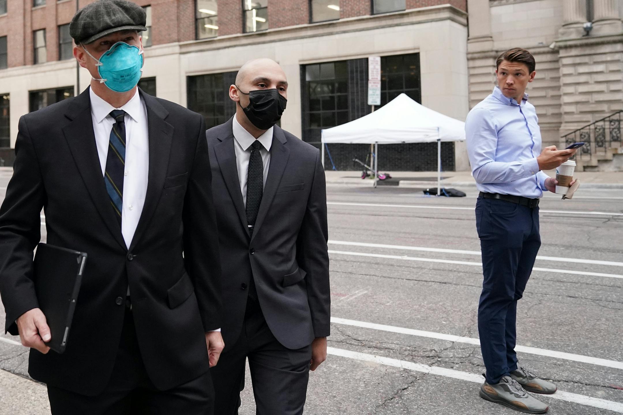 Former Minneapolis police officer J. Alexander Kueng arrived with his attorney Thomas Plunkett at the Hennepin County Family Justice Center for Friday's hearing.