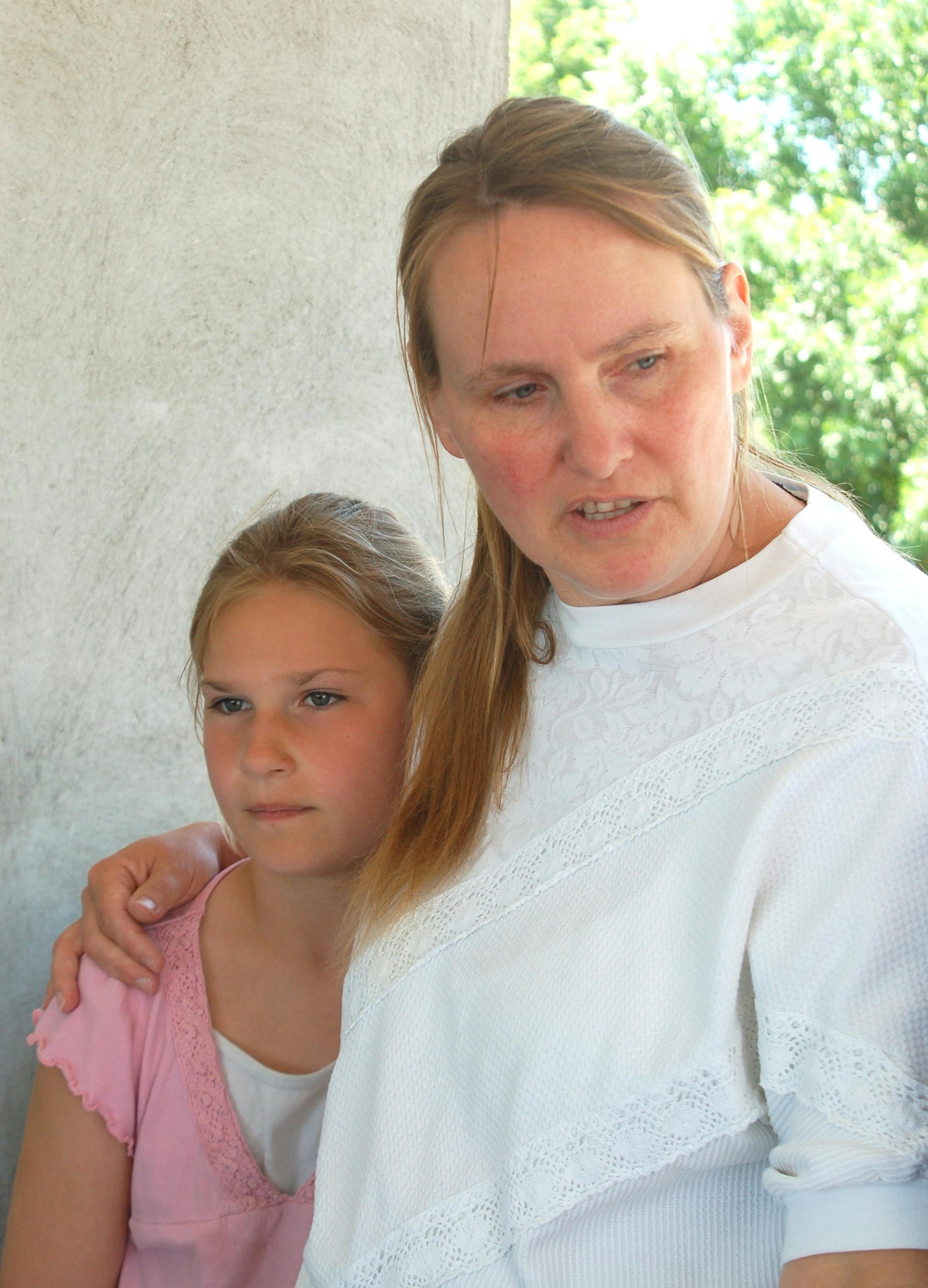 Carol Race, with daughter Andrea, 9, in June, looks to continue mediation and consult a lawyer.