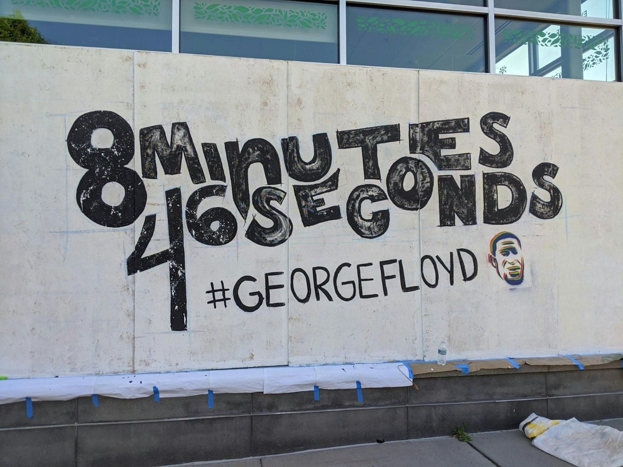 Artists Patricio De Lara and Taylan DeJohnette worked on a mural at Seward Co-op (317 E. 38th St.) referencing how long ex-police officer Derek Chauvin pinned his knee onto George Floyd's neck before he died.