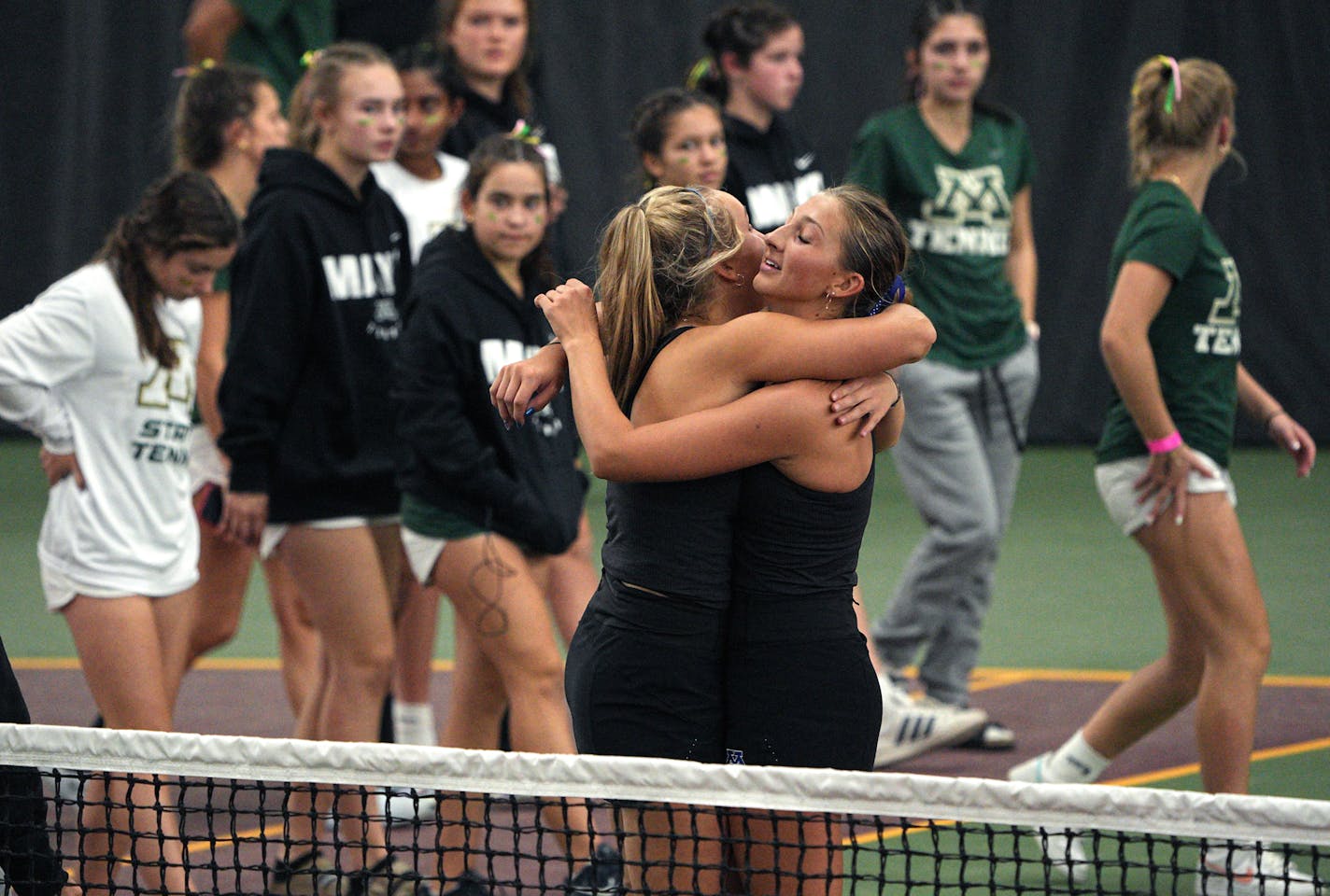 MinnetonkaÕs Kelsey Phillips (right) and Karina Elvestrom hug after they both won their singles matches of the Class 2A Team state tennis championship Wednesday, Oct. 26, 2022 at Baseline Tennis Center in Minneapolis, Minn. ] Brian Peterson ¥ brian.peterson@startribune.com