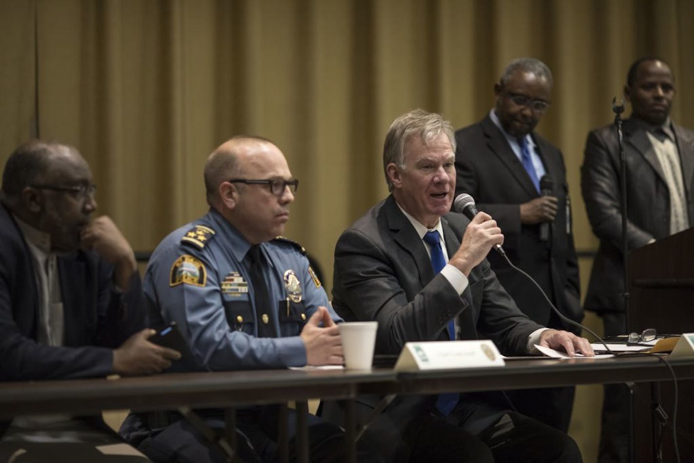 St. Paul Mayor Chris Coleman, with mic, and Police Chief Todd Axtell in February.