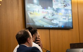 Defendant Derrick Thompson listens Minneapolis Police Department Sgt. David Ligneel testfies of security footage of the crash during his criminal tria