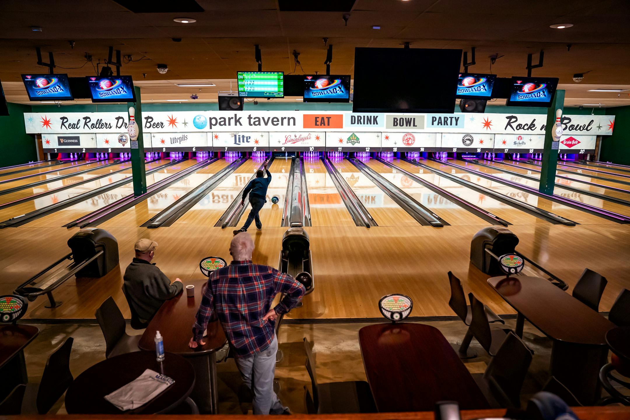The bowling center at Park Tavern, St Lous Park, is largely empty. State restrictions require six feet between people allowing every other lane to be left empty.