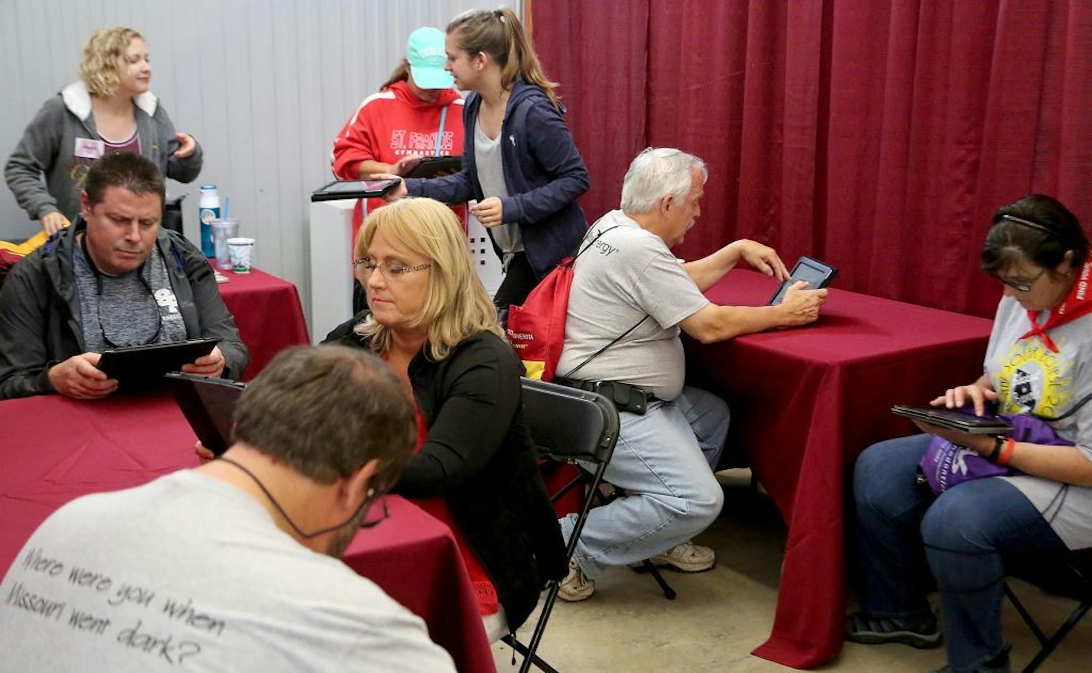 A variety of medical researchers from the University of Minnesota described their research projects and recruited volunteers at the U of M's Driven to Discover building at the Minnesota State Fair Friday, Aug. 25, 2017, in St. Paul, MN. Here, volunteers use e tablets to answer health research questionnaires.
