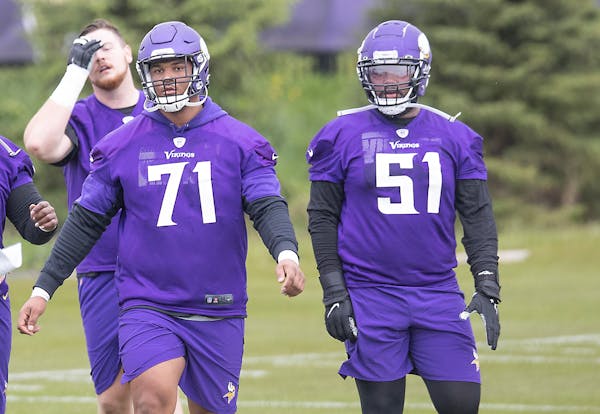 Vikings rookies, including defensemen Christian Darrisaw (71), left, and Wyatt Davis (51), practiced at TCO Performance Center, Friday, May 14, 2021 i
