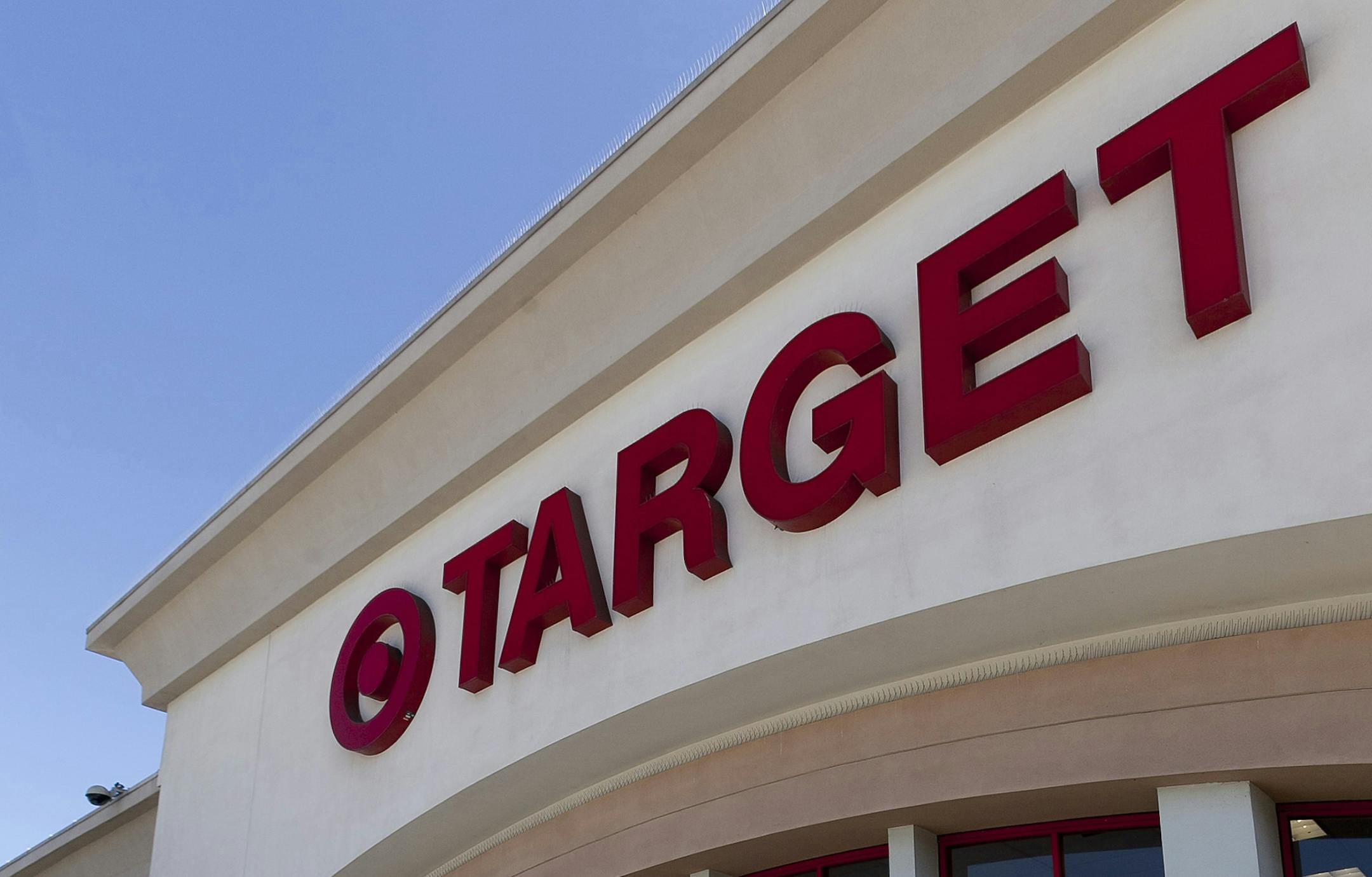 FILE - In this Tuesday, July 16, 2011 photo, a customer leaves a Target store in Los Angeles. In the latest effort to beat Amazon.com at its game, Target says that for the first time it will match prices that customers find on identical products at select online competitors this holiday season. Target Corp.'s CEO Gregg Steinhafel on Tuesday, Oct. 16, 2012 told about 80 reporters at a company media conference that the retailers include Amazon.com, Walmart.com, Bestbuy.com, Toysrus.com and babiesr