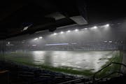 Allianz Field flooded during a storm on Wednesday. The game, tied 1-1 in the 18th minute, was suspended until Thursday.