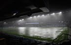 Allianz Field flooded during a storm on Wednesday. The game, tied 1-1 in the 18th minute, was suspended until Thursday.