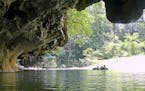 In an undated handout photo, the Barton Creek Cave in Belize. Hotel properties are giving guests different destinations in one trip &#x2014; including