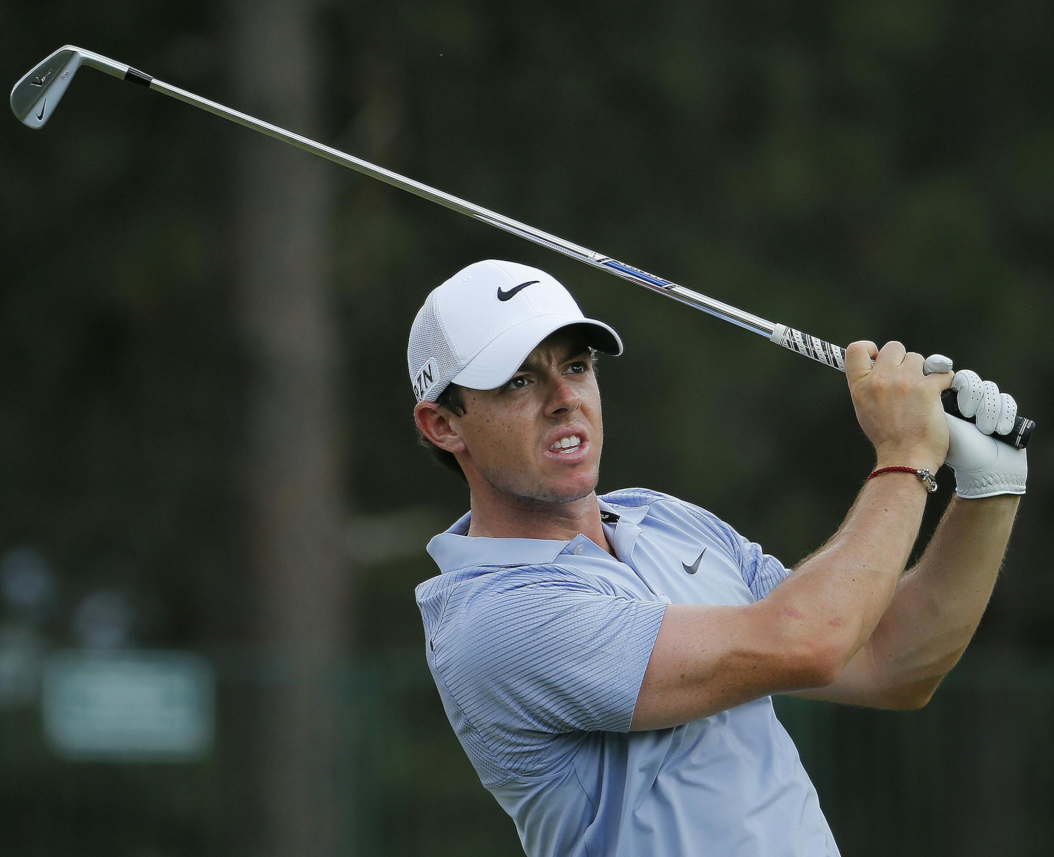 Rory McIlroy, of Northern Ireland, watches his tee shot on the 13th hole during a practice round for the U.S. Open golf tournament in Pinehurst, N.C., Wednesday, June 11, 2014. The tournament starts Thursday. (AP Photo/Matt York)