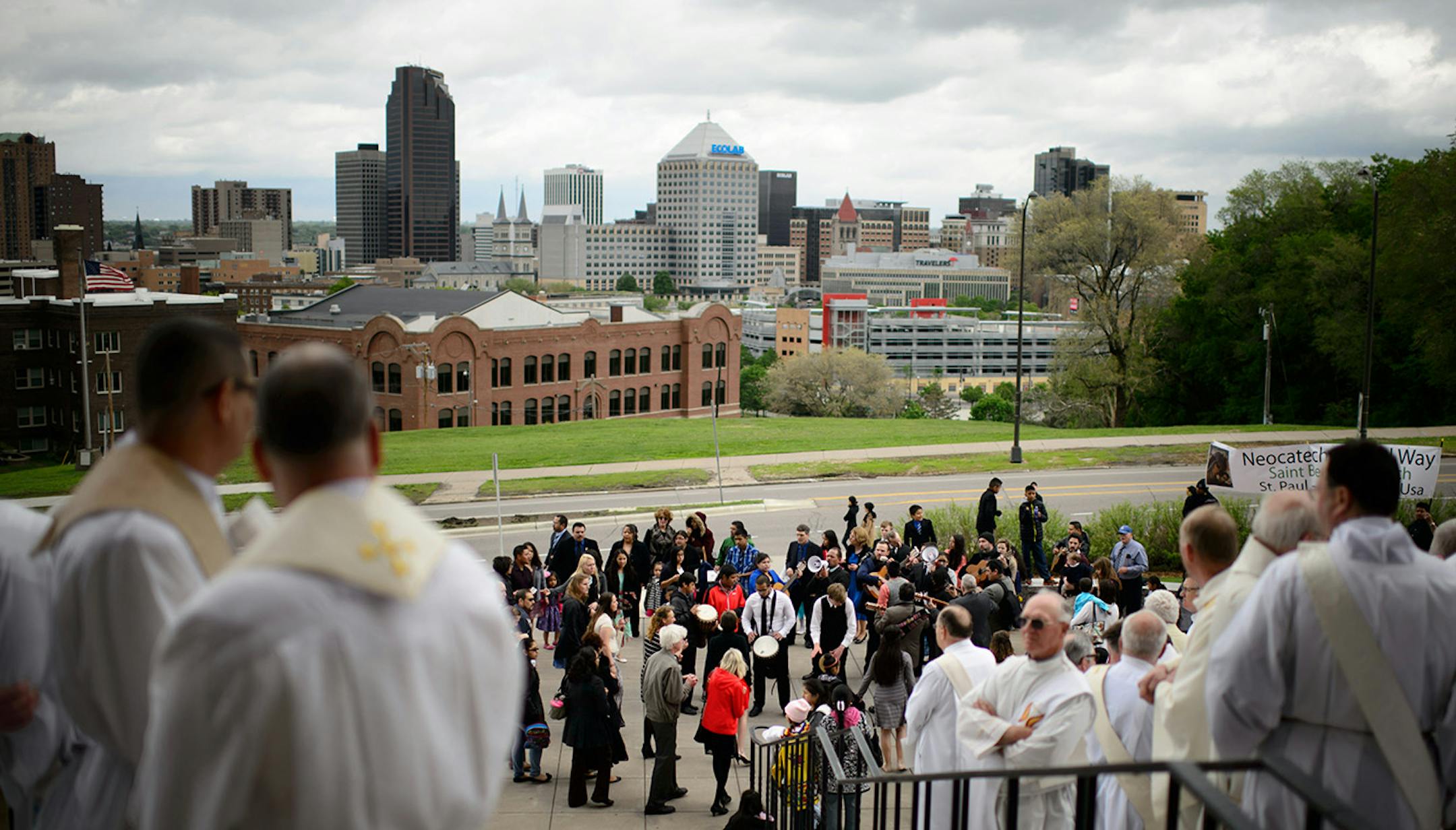 Priests and deacons lined up outside the cathedral for the start of the installation mass of Archbishop Bernard Hebda.