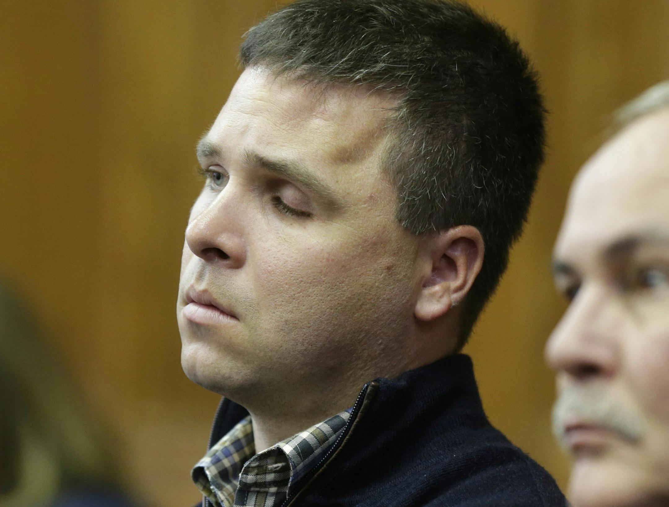 In this Oct. 5, 2015, photo, former Milwaukee Police Officer Graham Kunisch who was shot several times, losing an eye and part of the frontal lobe of his brain, testifies in court during the Badger Guns trial in a Milwaukee. Kunisch and Milwaukee Police Officer Bryan Norberg brought a lawsuit against a Wisconsin gun shop that they say has sold hundreds of weapons used in crimes. The potentially precedent-setting case hinges on whether the gun shop owners should be financially responsible for a c