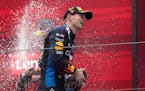 Red Bull driver Max Verstappen celebrates on the podium after winning the Chinese Grand Prix in Shanghai on Sunday.