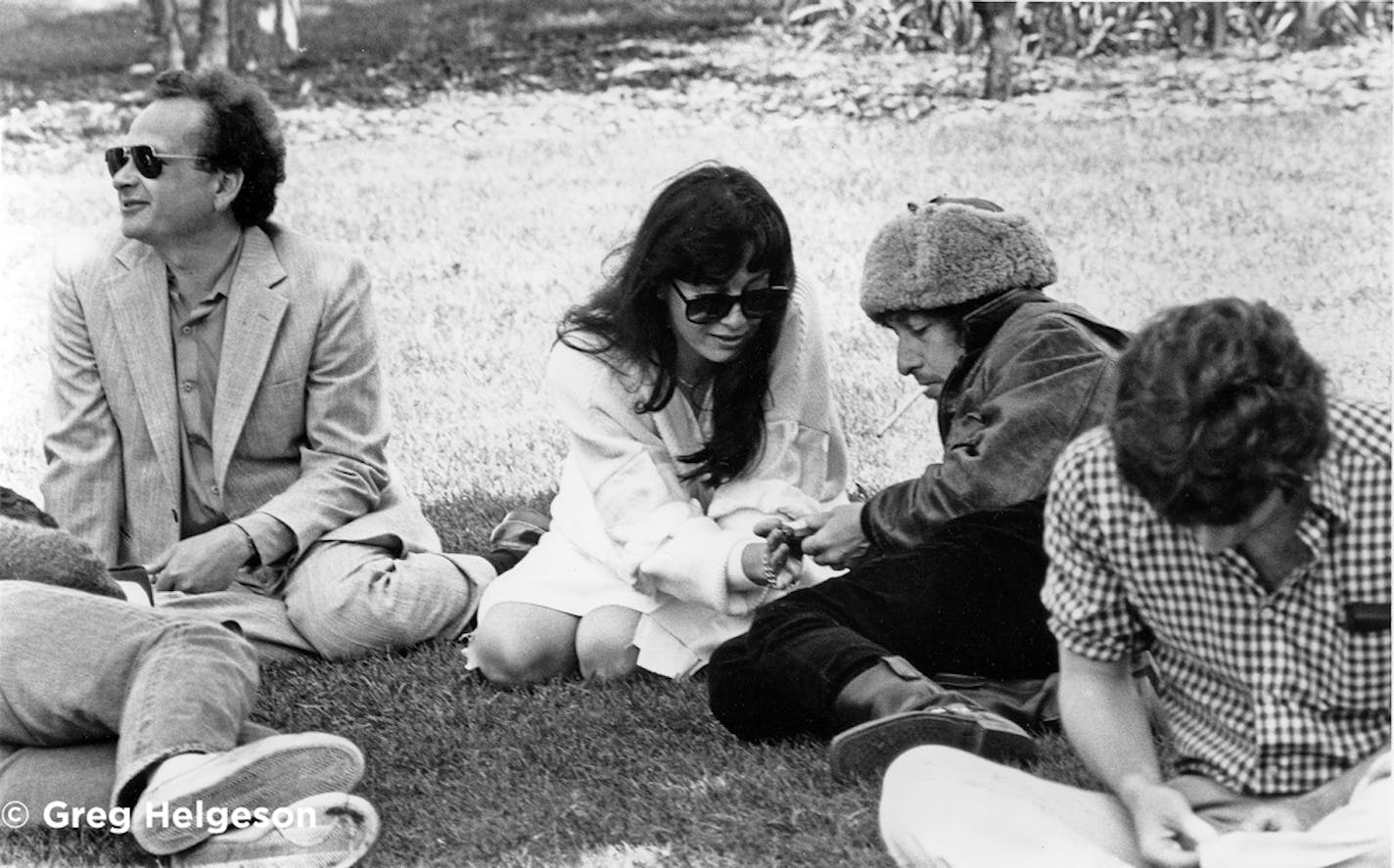 Bob Dylan with his ex-wife, Sara, and brother, David Zimmerman, on the lawn at Macalester College in 1983. The Dylans' daughter Maria was graduating and, by concidence, the college had hired Greg Helgeson to phgtograph the ceremony.