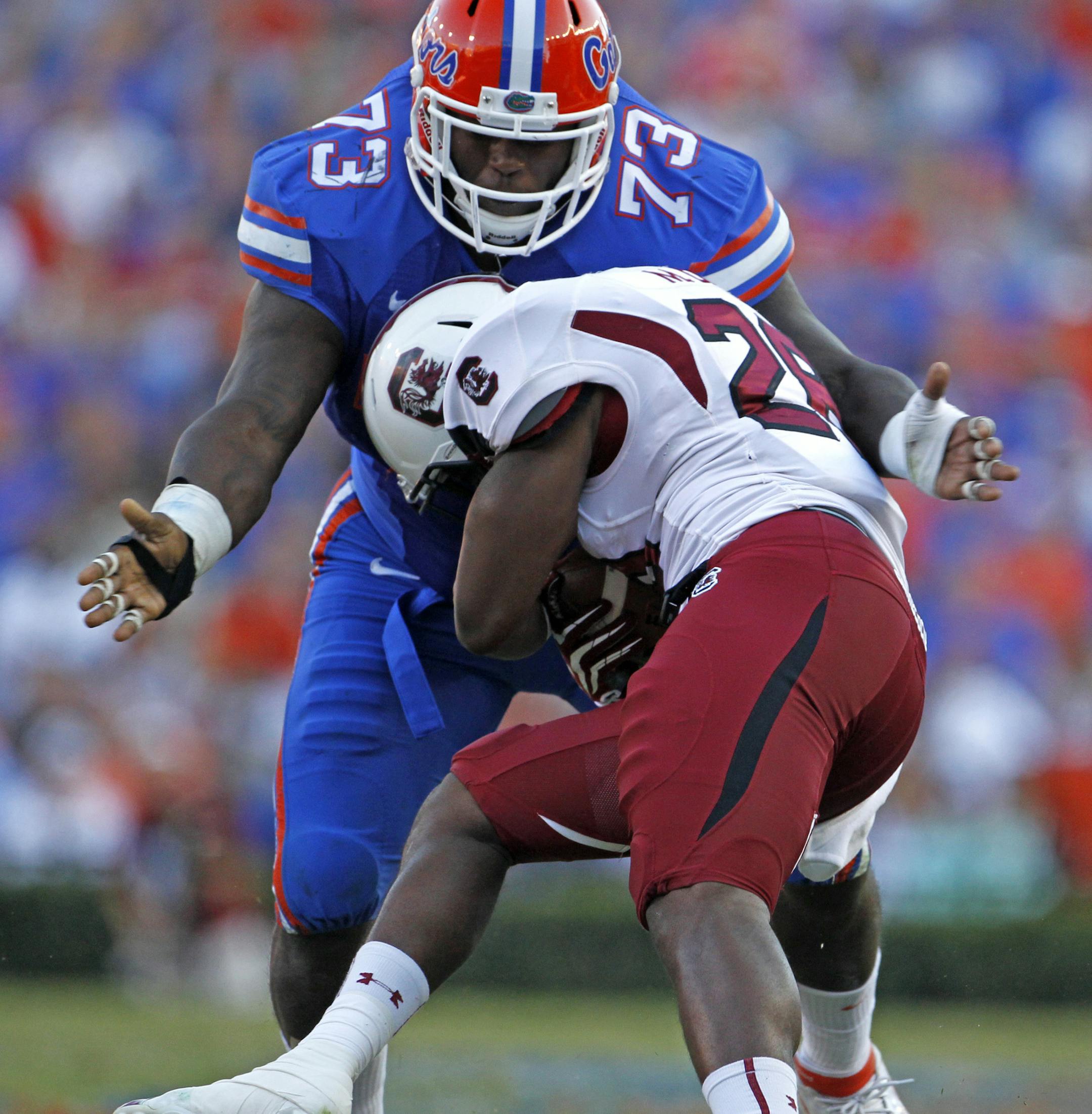 Florida defensive lineman Sharrif Floyd (73) stops South Carolina running back Mike Davis (28) for a 3-yard loss on a run play in the third quarter at Ben Hill Griffin Stadium in Gainesville, Florida, on Saturday, Ocotber 20, 2012. (Gerry Melendez/The State/MCT) ORG XMIT: 1130298