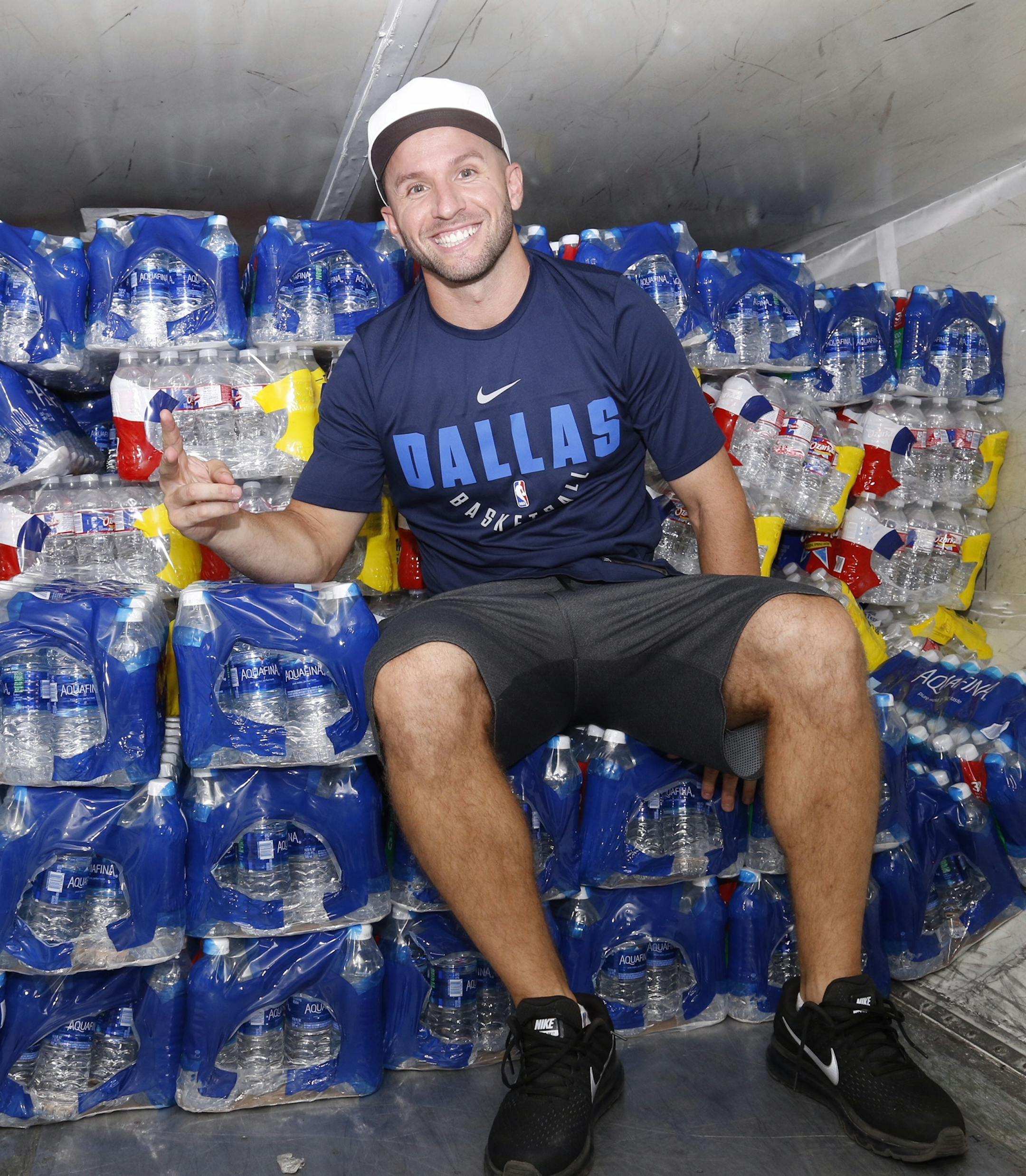 J.J. Barea sat in front of supplies bound for hurricane-stricken Puerto Rico, his native island.