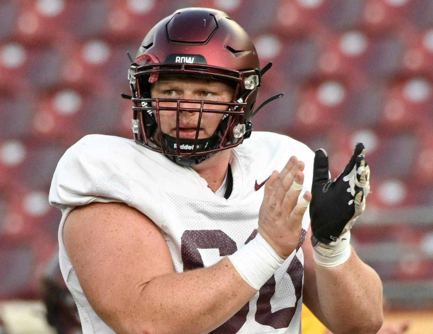 Minnesota Golden Gophers offensive lineman John Michael Schmitz (60) claps during a Minnesota Gophers open football practice Thursday, Aug. 11, 2022 at Huntington Bank Stadium in Minneapolis, Minn.. ] aaron.lavinsky@startribune.com ORG XMIT: MIN2208112050170121