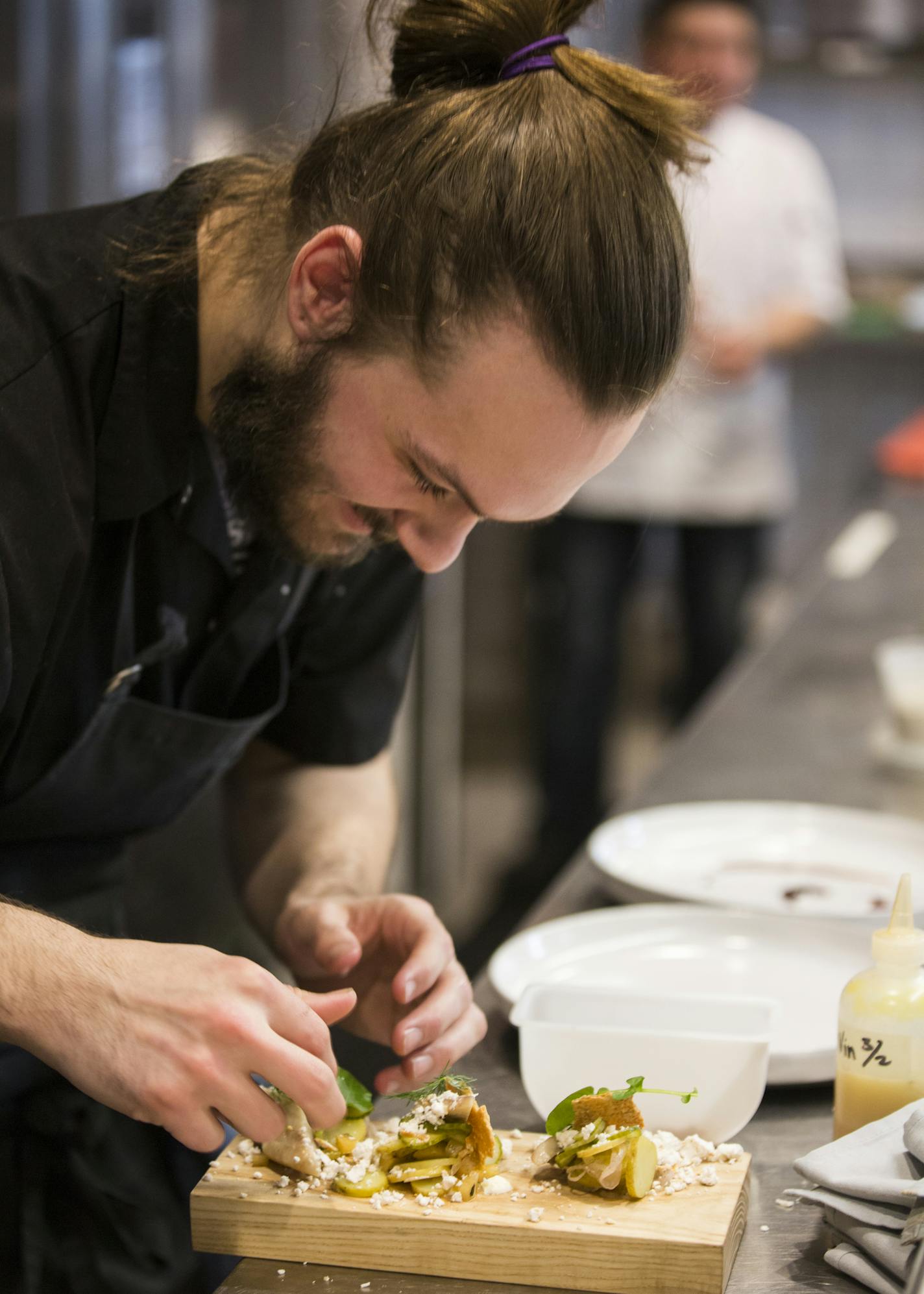 Chef de cuisine Erich Scheie prepares a dish at Upton 43 in Minneapolis.