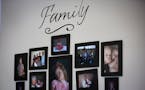 Pictures are hung on a wall in the living room of Heather Sawyer�s Belle Plaine home.