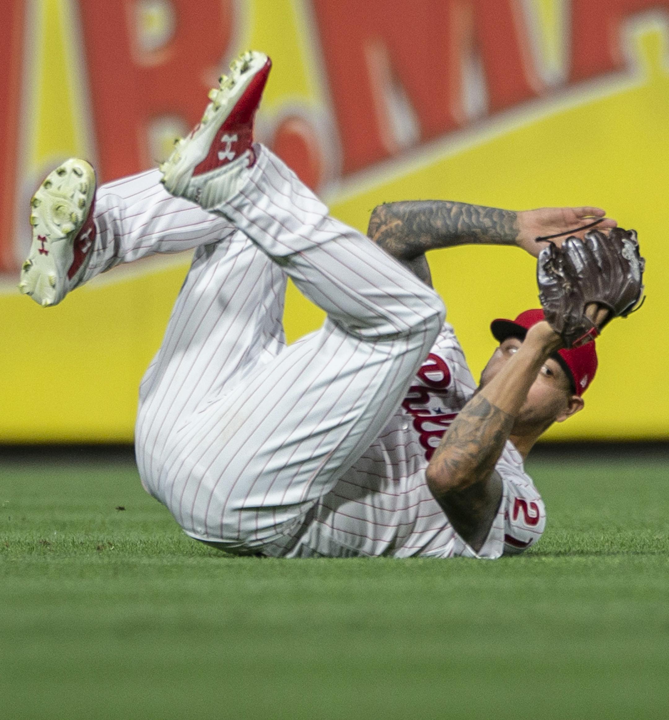 Philadelphia Phillies' Vince Velasquez (21) catches a line drive by Chicago White Sox's Eloy Jimenez during the 15th inning of a baseball game, early Saturday, Aug. 3, 2019, in Philadelphia. The White Sox won 4-3. (AP Photo/Laurence Kesterson)