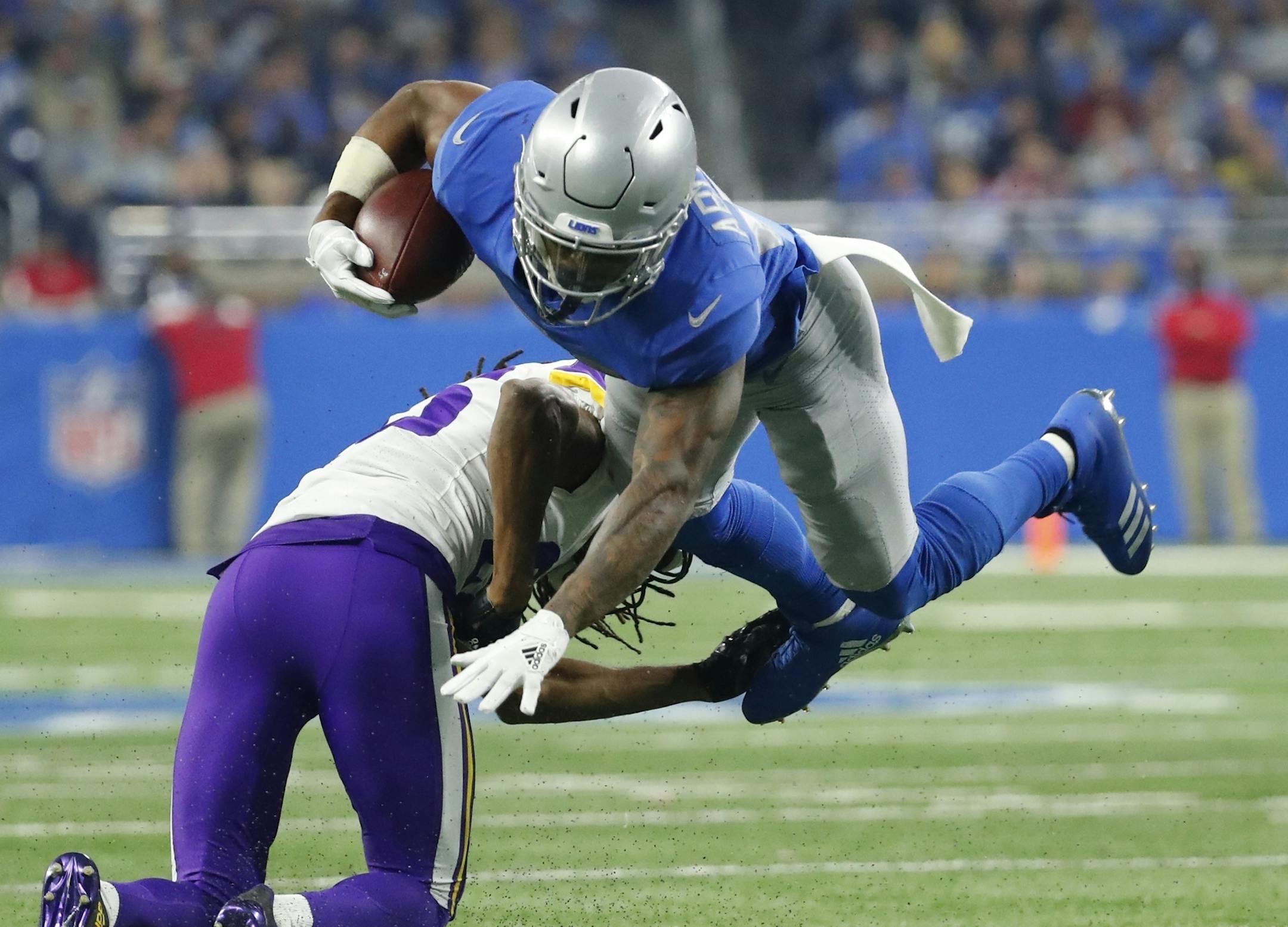 Minnesota Vikings cornerback Trae Waynes upends Detroit Lions running back Ameer Abdullah during the second half of an NFL football game, Thursday, Nov. 23, 2017, in Detroit. (AP Photo/Rick Osentoski)