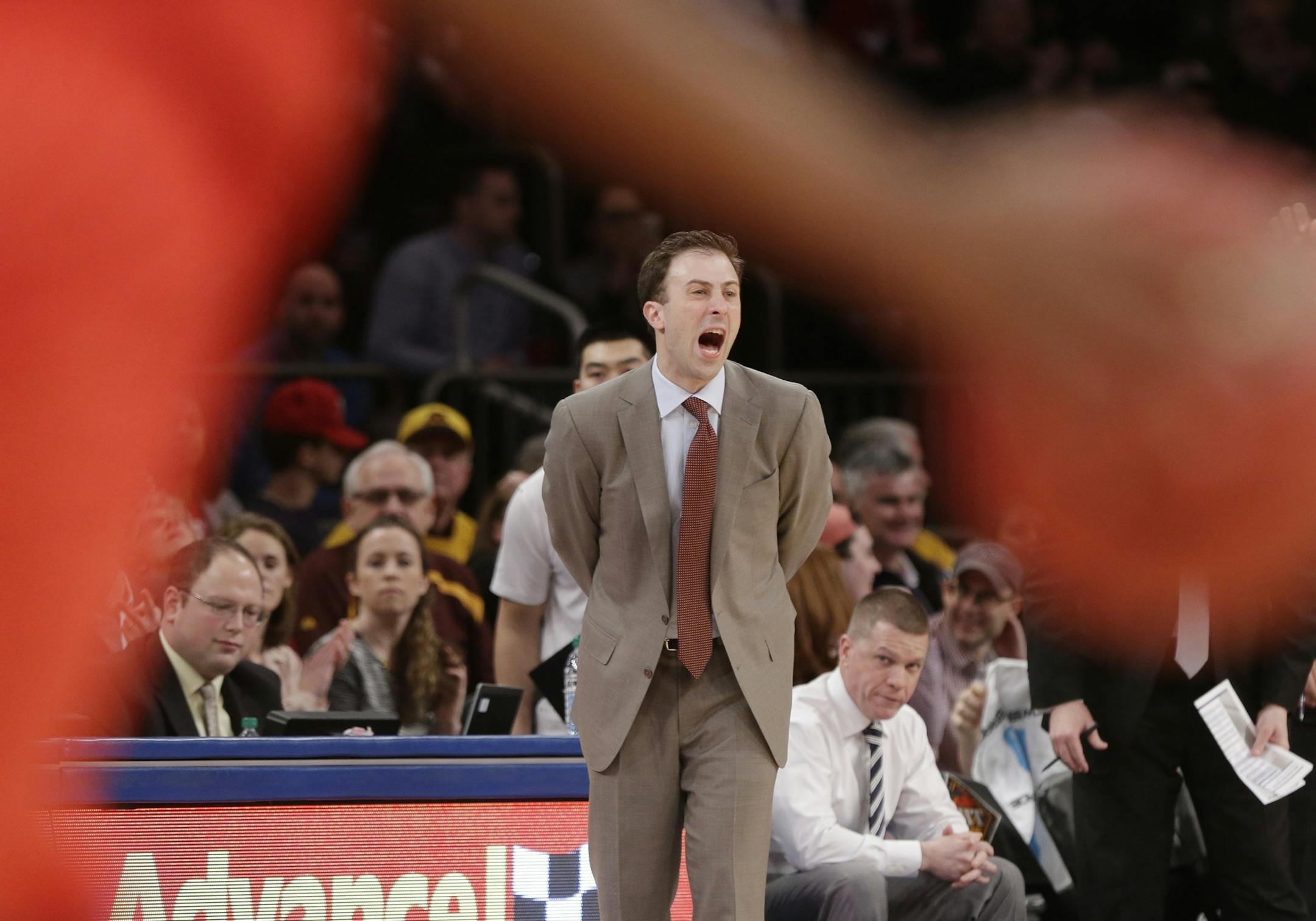 Minnesota head coach Richard Pitino calls out to his team during the first half of an NCAA college basketball game against SMU in the finals of the NIT Thursday, April 3, 2014, in New York. (AP Photo/Frank Franklin II)