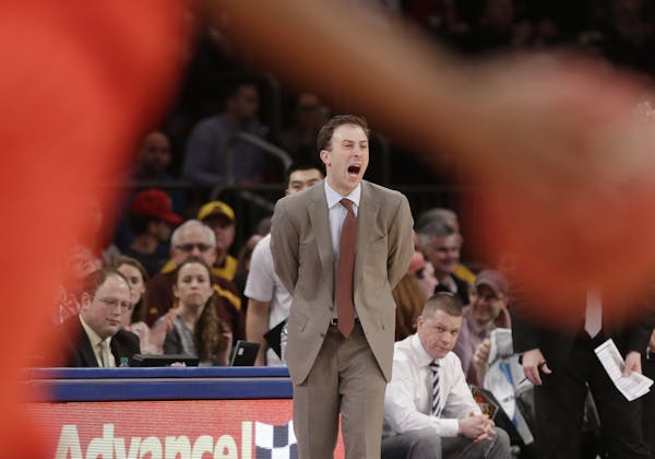 Minnesota head coach Richard Pitino calls out to his team during the first half of an NCAA college basketball game against SMU in the finals of the NI