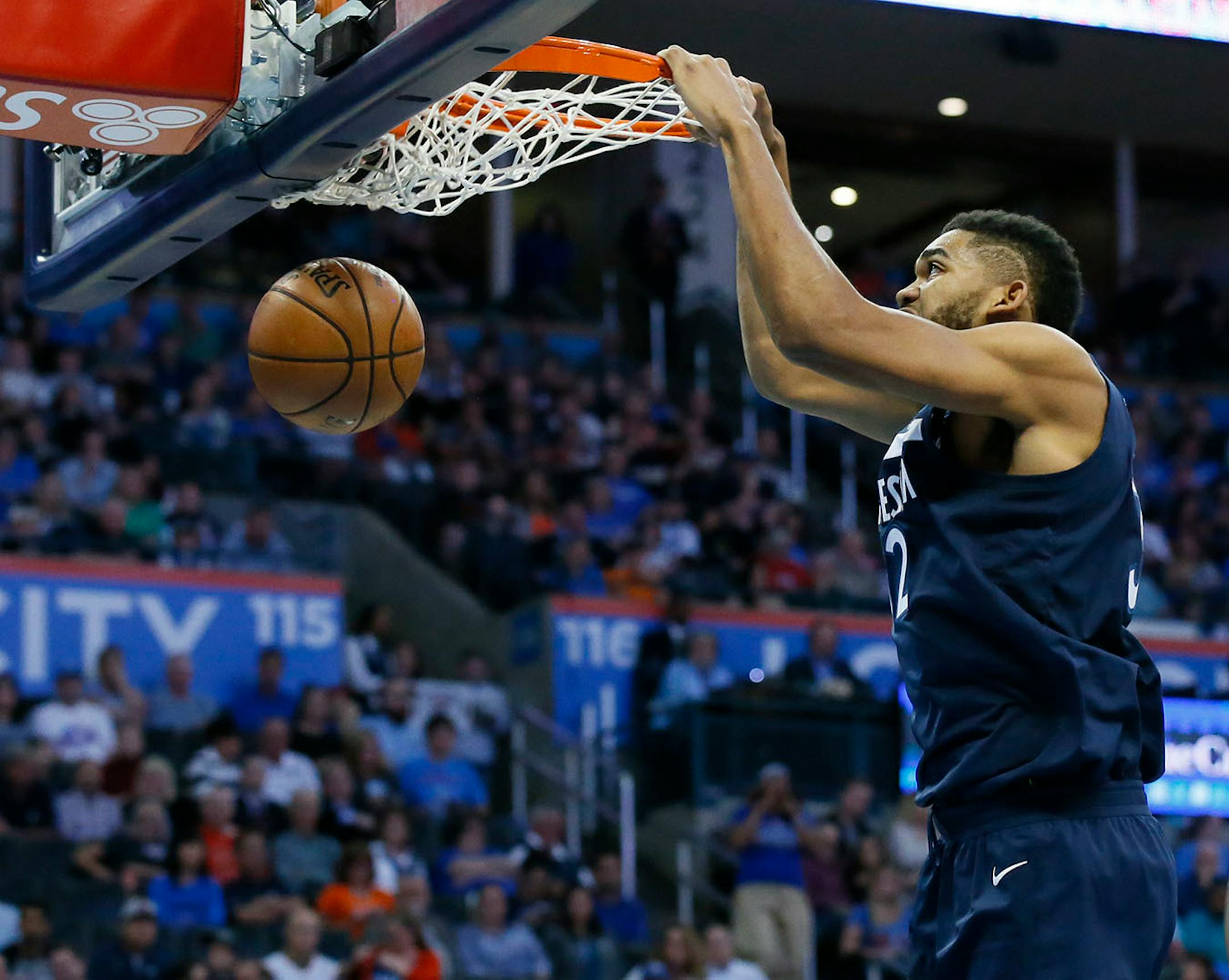 Minnesota Timberwolves center Karl-Anthony Towns dunks in the second quarter of an NBA basketball game against the Oklahoma City Thunder in Oklahoma City, Sunday, Oct. 22, 2017.