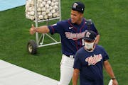 Minnesota Twins pitcher José Berríos (17) walked with pitching coach Wes Johnson (47) as he took the field during practice Friday. ] ANTHONY SOUFFLE