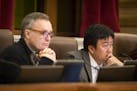 Minneapolis City Council Members Cam Gordon, left, and Blong Yang pictured at a meeting in 2015.