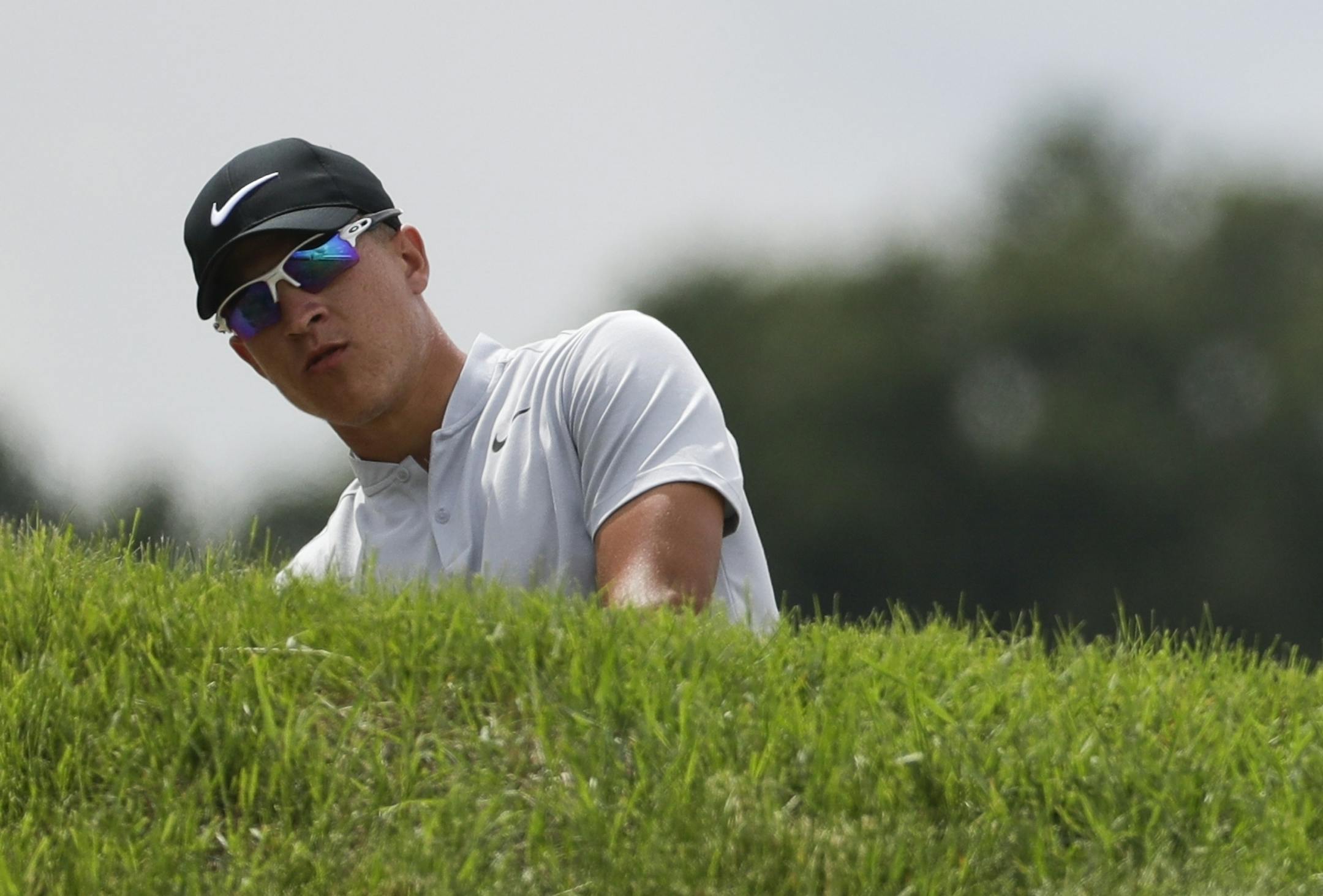 Cameron Champ hits to the sixth green during the third round of the U.S. Open golf tournament Saturday, June 17, 2017, at Erin Hills in Erin, Wis. (AP Photo/Chris Carlson)