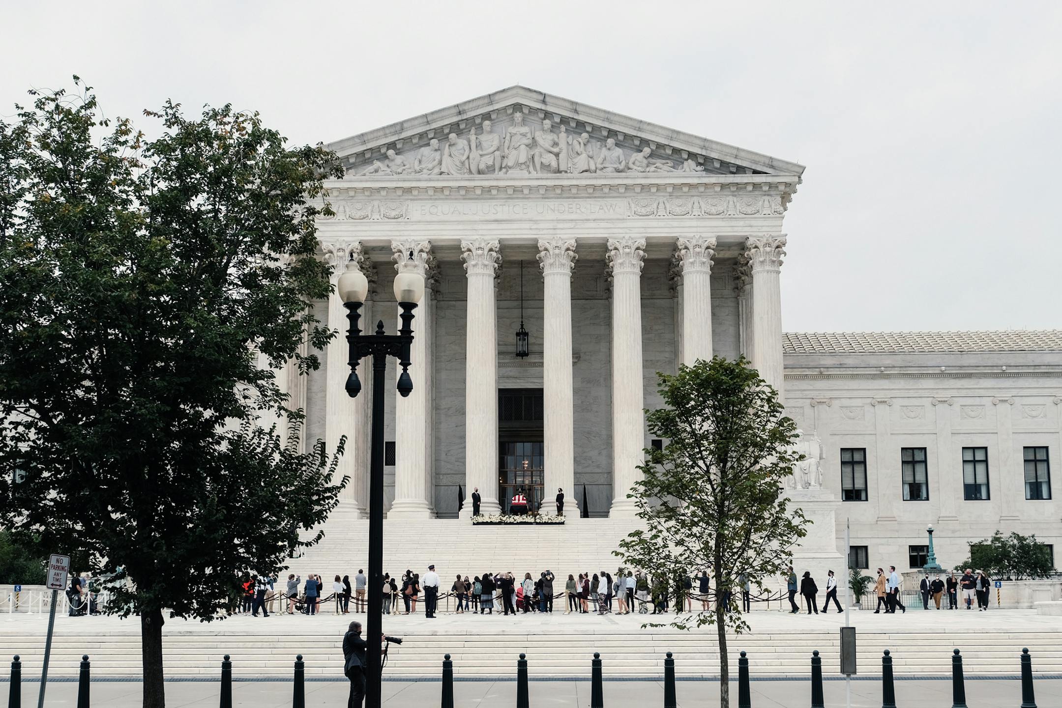 People pay their respects to the late Justice Ruth Bader Ginsburg at the Supreme Court in Washington on Thursday, Sept. 24, 2020. President Donald Trump's pick to replace Ginsburg is likely to galvanize Democrats while bringing him few new voters, and could hurt some Republican Senate incumbents. (Michael A. McCoy/The New York Times)
