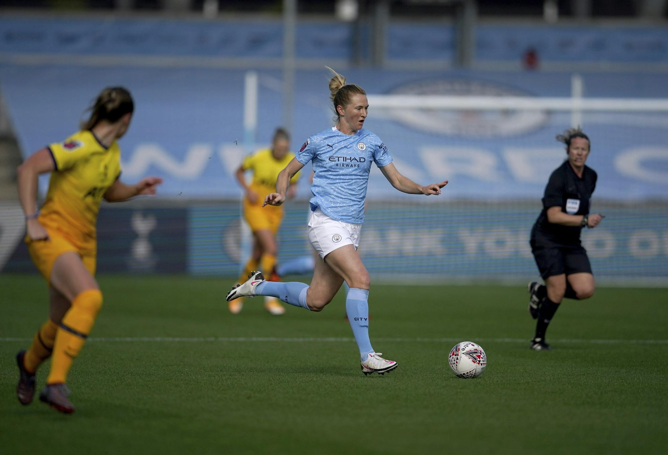 Manchester City's Sam Mewis, center, in action in the Women's Super League soccer match between Manchester City Women and Tottenham Hotspur Women at the Academy Stadium, Manchester Sunday Oct. 4, 2020. (AP Photo/Dave Thompson)