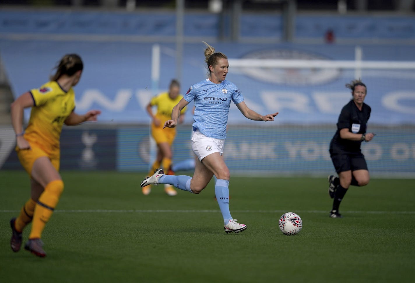 Manchester City's Sam Mewis, center, in action in the Women's Super League soccer match between Manchester City Women and Tottenham Hotspur Women at the Academy Stadium, Manchester Sunday Oct. 4, 2020. (AP Photo/Dave Thompson)