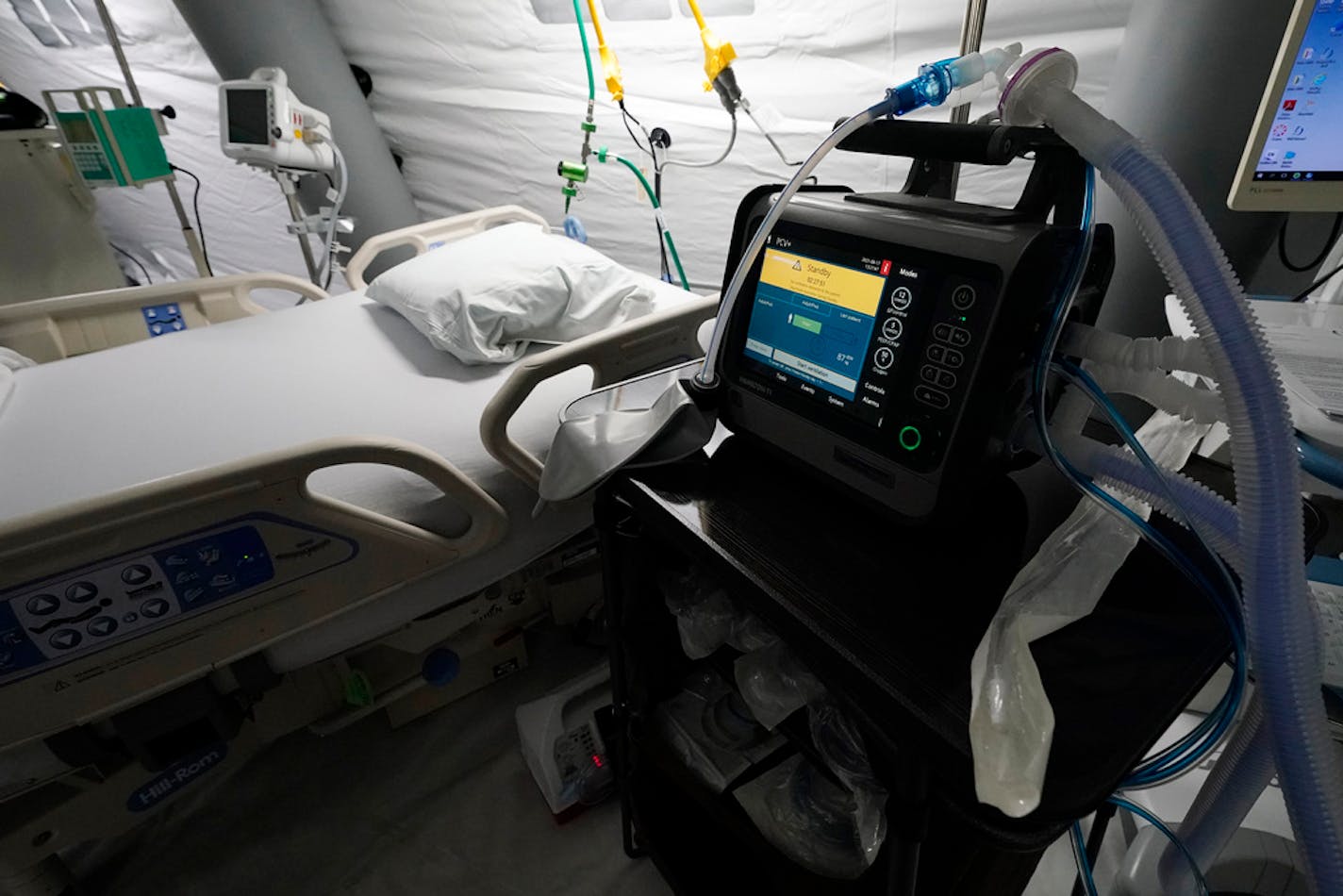 Ventilators sit beside each of the five intensive care beds that are part of the 32-bed Samaritan's Purse Emergency Field Hospital set up in one of the University of Mississippi Medical Center's parking garages, Tuesday, Aug. 17, 2021, in Jackson, Miss. The field hospital joins a 20-bed field hospital and monoclonal antibody clinic opened by the U.S. Department of Health and Human Services at UMMC in response to the rising number of COVID-19 cases in the state. (AP Photo/Rogelio V. Solis)