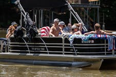 Gophers quarterback Max Brosmer, middle, played host to a dozen of his new teammates earlier this month at his family's lake home on Lake Hartwell in 
