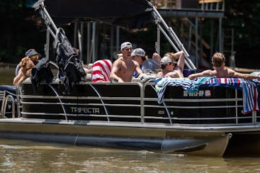 Gophers quarterback Max Brosmer, middle, played host to a dozen of his new teammates earlier this month at his family's lake home on Lake Hartwell on 