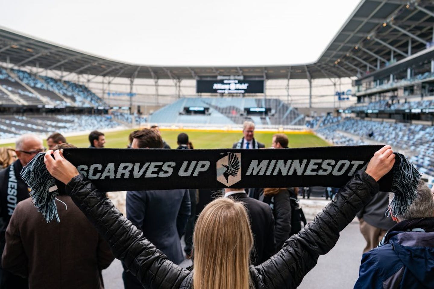 The team distributed scarves to VIP attendees.