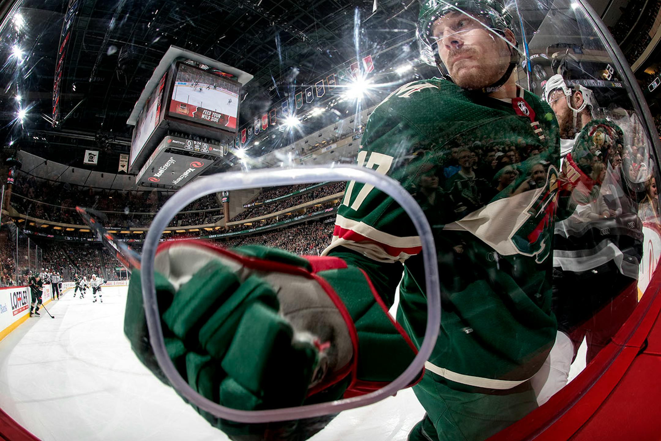 Marcus Foligno (17) into the glass in the first period.