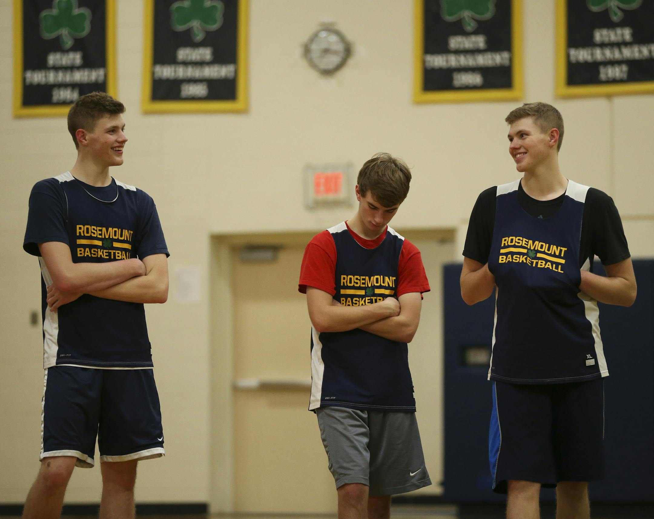 Rosemount's Alec Loehr, left, shared a laugh with his twin brother, Luke, as they sat out with Blake Tamminen while their teammates ran a drill during practice Monday afternoon. (Jeff Wheeler/Star Tribune)