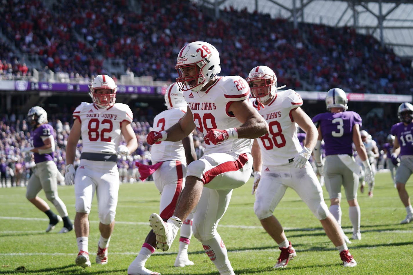 St. John's running back Kenneth Udoibok celebrated after scoring a touchdown in October vs. St. Thomas.