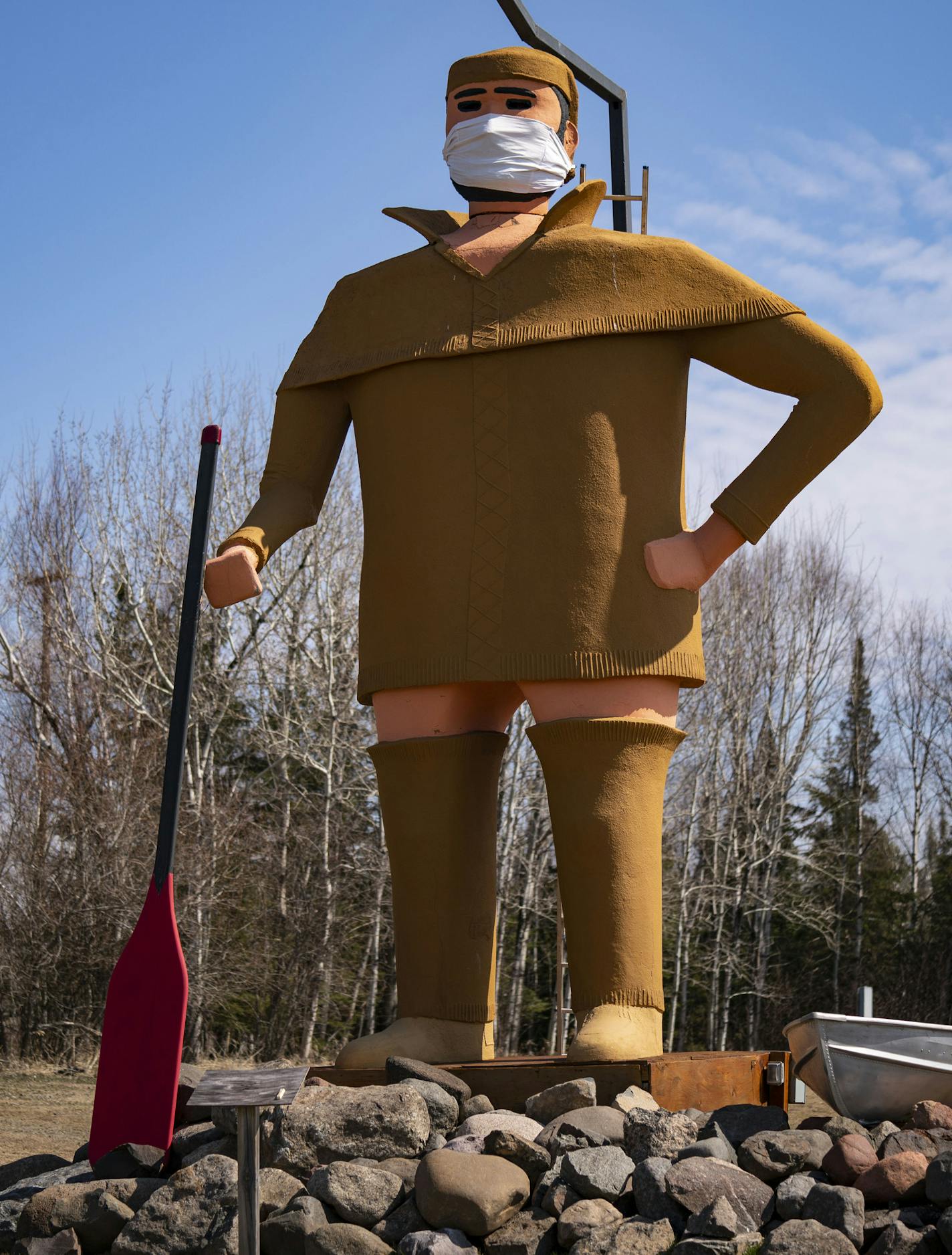 Pierre the Voyageur statue in Two Harbors, MN has been fitted with a mask amidst the COVID-19 pandemic and stood tall on April 23, 2020. ] ALEX KORMANN • alex.kormann@startribune.com Pierre the Voyageur statue in Two Harbors, MN has been fitted with a mask amidst the COVID-19 pandemic.