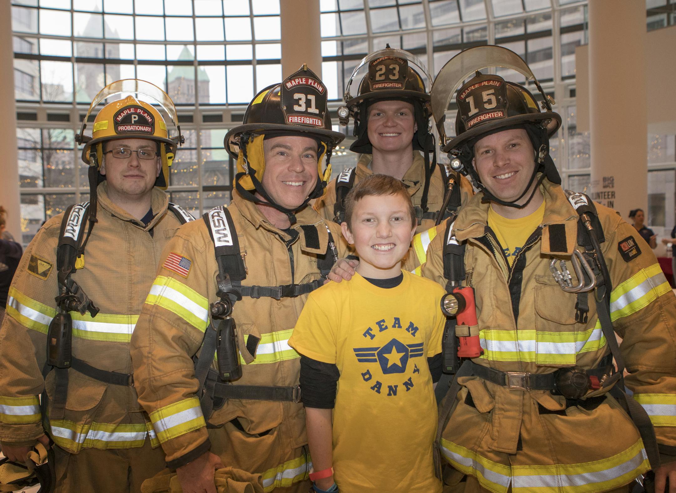 Danny Valerius with Maple Plaine firefighters Jake Delisle, Tom Lowery, Brian Doyle and Kevin Kolkind.