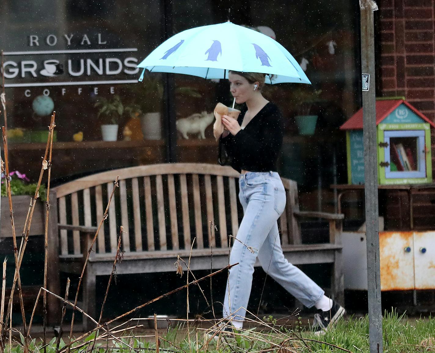 Royal Grounds coffee shop owners Jim and Joanne Heider, not pictured, have seen business drop by about 5o percent and had to let several employees go as they work to figure out ways to stay afloat during the Coronavirus pandemic. Here, a customer is seen leaving the Southside business with a coffee drink Tuesday, April 28, 2020, in Minneapolis, MN.] DAVID JOLES &#x2022; david.joles@startribune.com Most independent coffee shops are shut down but a handful struggle to stay open. Furst will profile