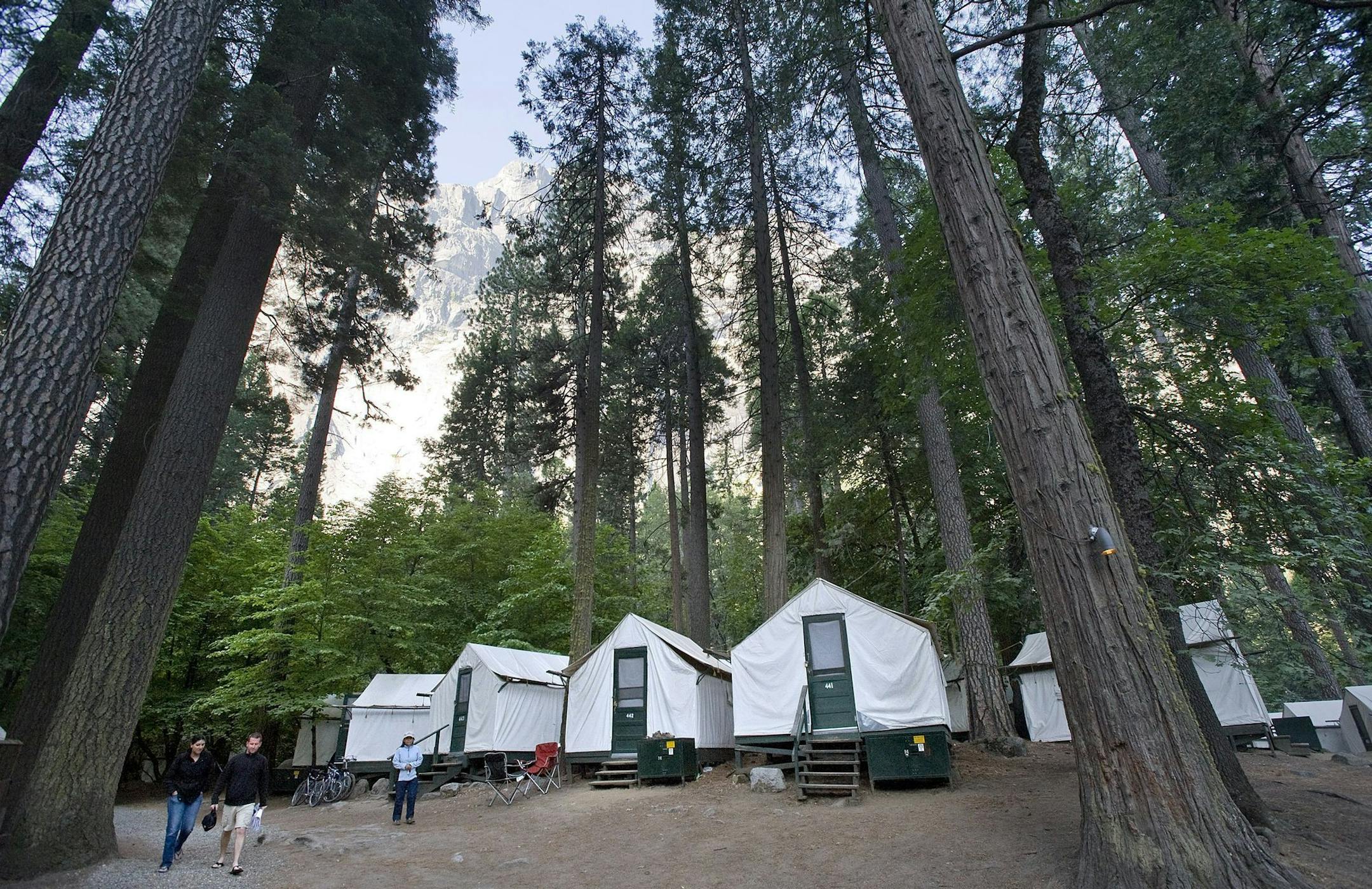 Glacier point rises above the tent cabins at Curry Village in Yosemite National Park in California. After the hantavirus outbreak, all the double-walled "Signature Series" tent cabins were demolished and replaced with new single-walled traditional tent cabins. (Jebb Harris/Orange County Register/MCT)