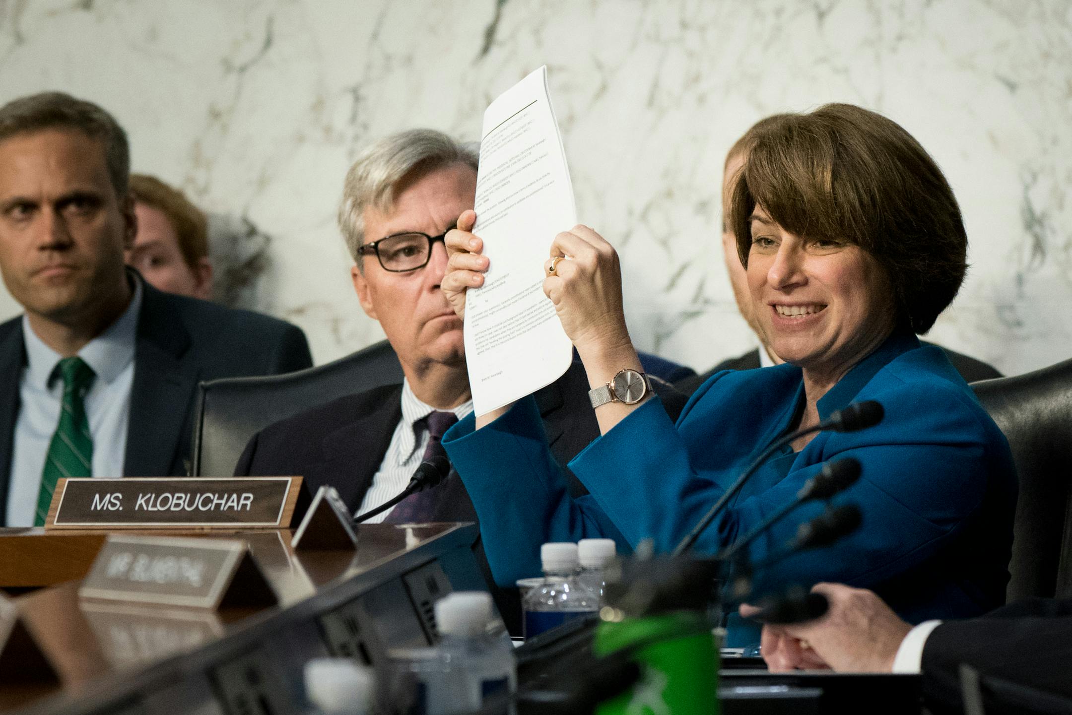 Sen. Amy Klobuchar (D-Minn.) holds up documents during the Senate Judiciary Committee's confirmation hearing for Judge Brett Kavanaugh, President Donald Trump&#xed;s nominee for the U.S. Supreme Court, on Capitol Hill in Washington, Sept. 4, 2018. (Erin Schaff/The New York Times)