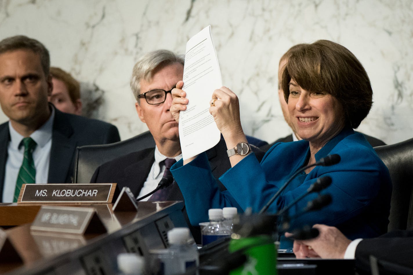 Sen. Amy Klobuchar (D-Minn.) holds up documents during the Senate Judiciary Committee's confirmation hearing for Judge Brett Kavanaugh, President Donald Trump&#xed;s nominee for the U.S. Supreme Court, on Capitol Hill in Washington, Sept. 4, 2018. (Erin Schaff/The New York Times)