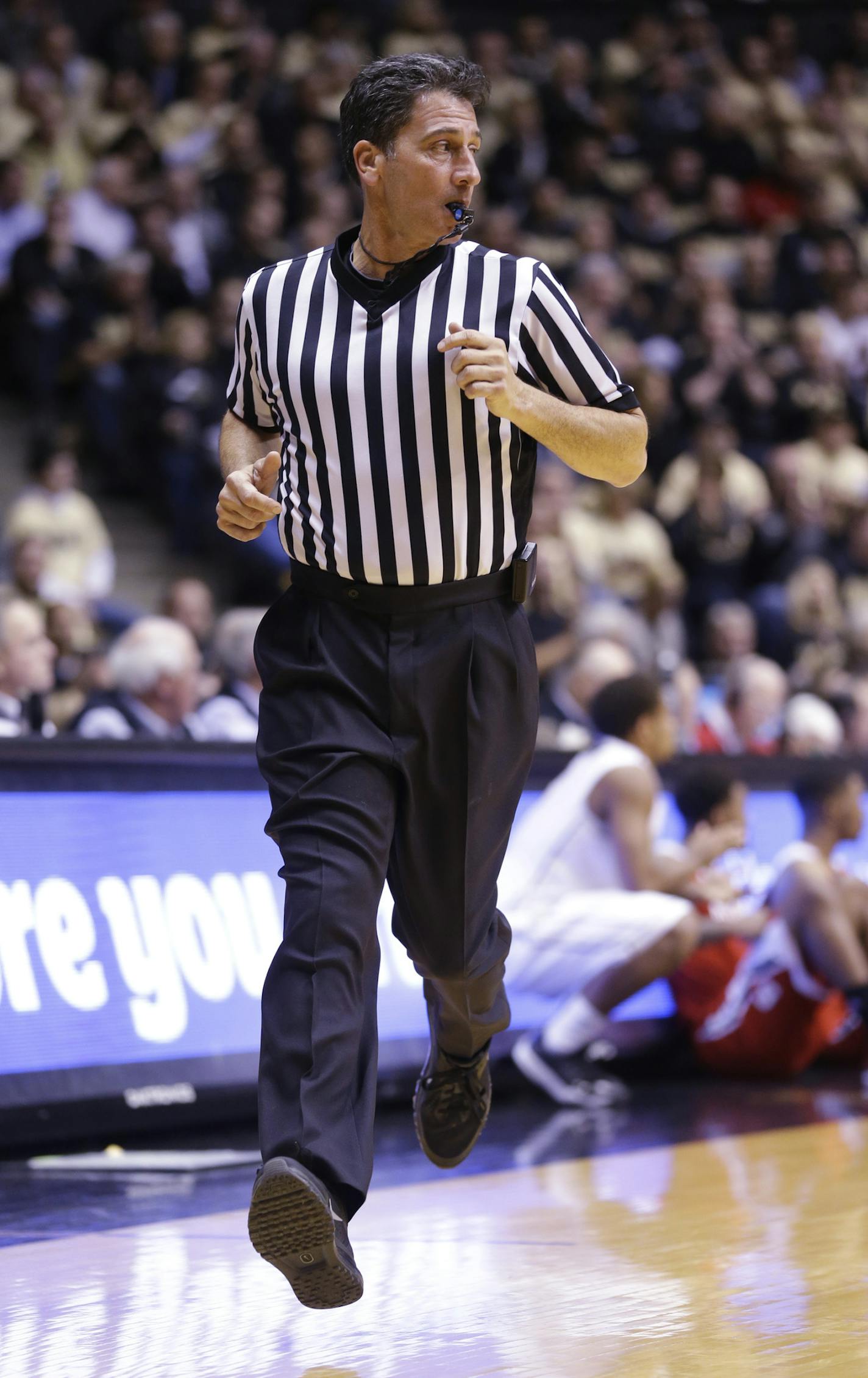 Official Gene Steratore runs down court in the first half of an NCAA college basketball game between Purdue and North Carolina State in West Lafayette, Ind., Tuesday, Dec. 2, 2014. Steratore is also an NFL referee. (AP Photo/Michael Conroy) ORG XMIT: INMC10