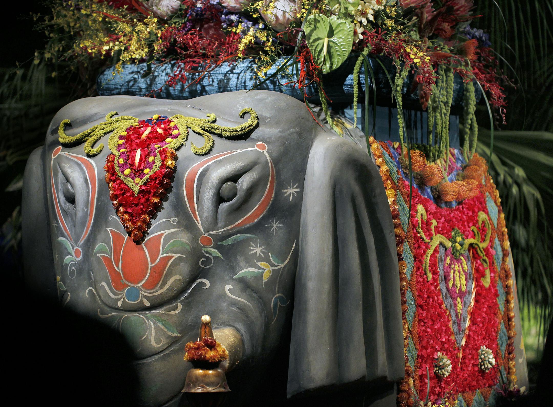 The flowers draped over the Elephant. Macy's/Bachman's 2013 flower show, "The Painted Garden", on the 8th floor of Downtown Macy's Minneapolis store. This years shops has the vibrant colors of South Asia. [ STAR TRIBUNE/TOM WALLACE Assignments #20028088B March 22, 2013 SLUG 663963 FLOWERSHOW032713 EXTRA INFORMATION Kim Palmer reporter.